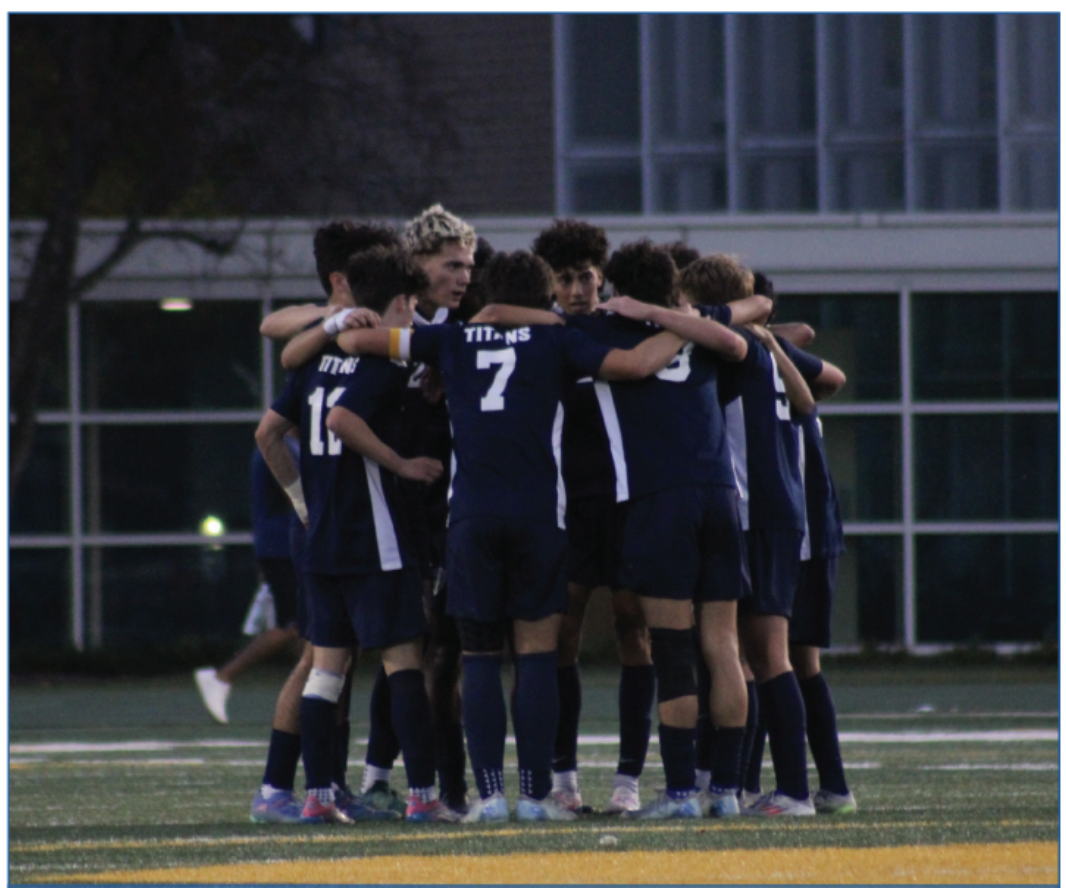 Hearty Huddle: As the North game nears its end, the team huddles a final time to prepare for the end of the game. Uplifting words are shared and chants are laced with blue and gold
pride.